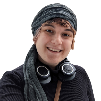 picture of june wunder smiling, she is a white woman wearing a gray tichel and brown hair peaking out from under the tichel. she is also wearing headphones